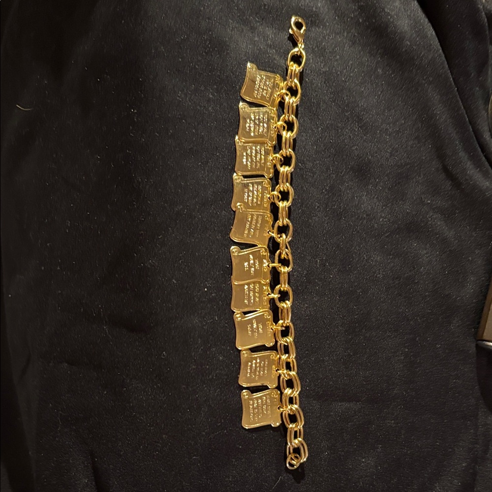 Gold Tone Ten Commandments charm bracelet, symbol of faith.
